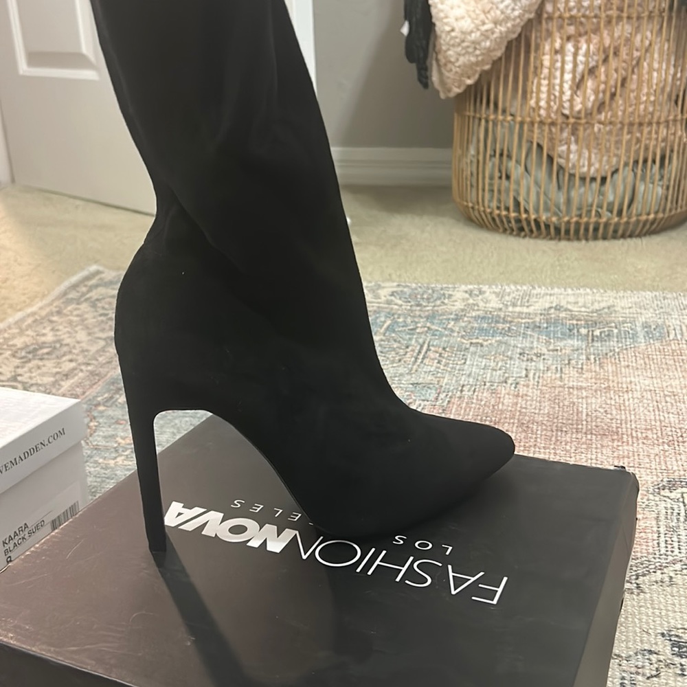 Thigh high black boot heels